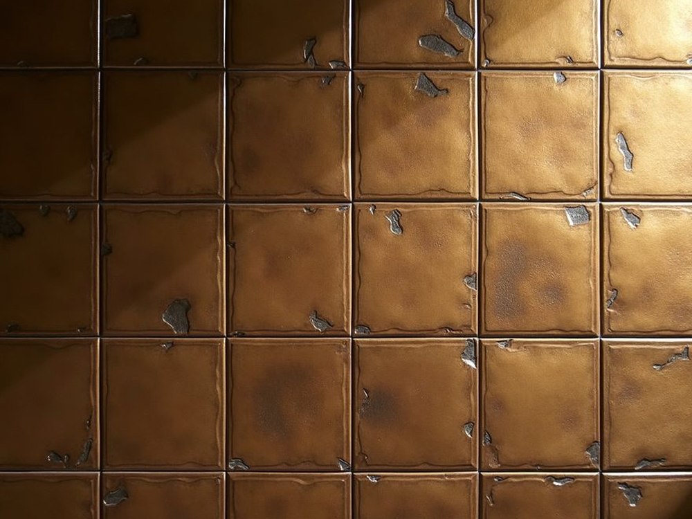 A wall of patinated bronze tiles.